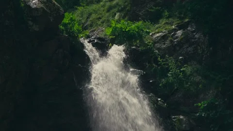 Close Up Waterfall Source with Two Streams Merging Over Rocky Cliff Stock Footage 333429660