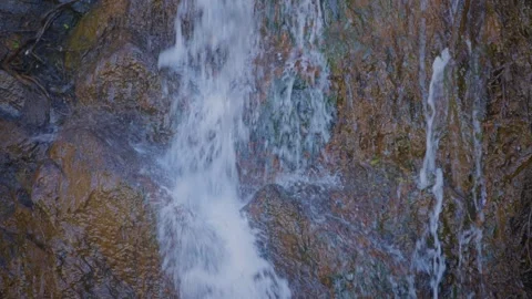 Close up of waterfall splashing against rocks Stock Footage 252260882