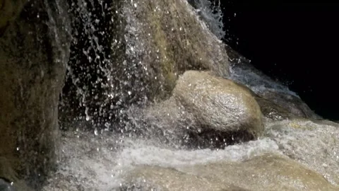 Close-up of a waterfall splashing on limestone mountain rocks Video stock 321321617