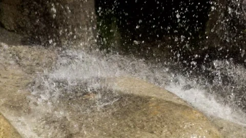 Close-up of a waterfall splashing on limestone mountain rocks Stock Footage 321321655