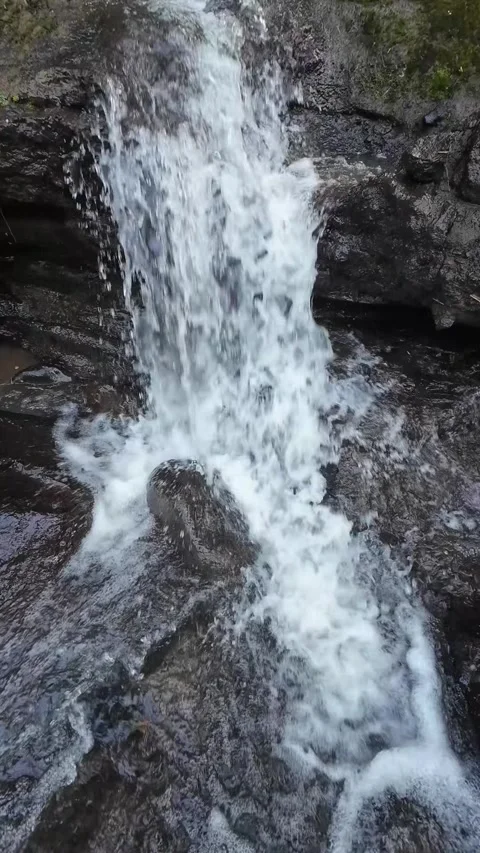 Close Up Waterfall Splashing Over Rocky River Bed in 4K Stock Footage 336748712