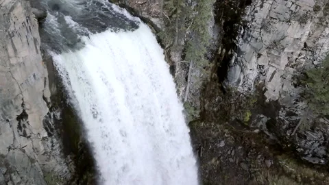 Close up of a waterfall with strong water flow on a big mountain Stock Footage 223366054