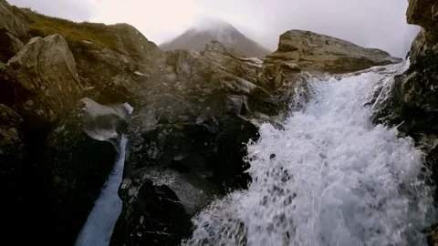 Close up of waterfall with water rushing by. Stock Footage 106073372