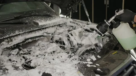 Close up of watering car engine compartment with foam from a hand sprayer. Video stock 289779655