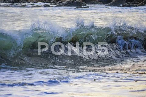 Close-up of a wave breaking at the shore,Wellington, New Zealand Stock Photos
