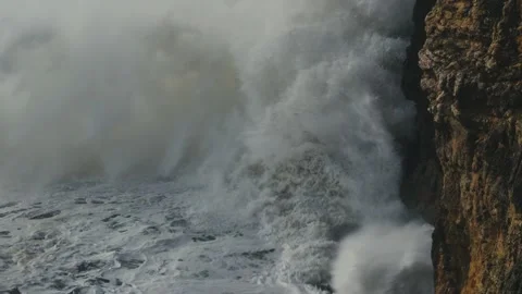 Close-up of a wave crashing into a rock Stock Footage 230969891
