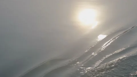 Close-up on the waves and the eddies caused by a boat on the sea Stock Footage 135453030