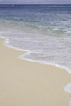 Close-up of waves breaking on the beach Stock Photos
