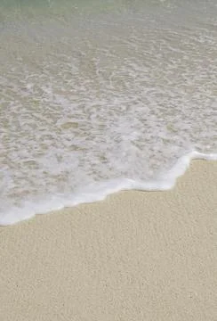 Close-up of waves breaking on the beach Stock Photos