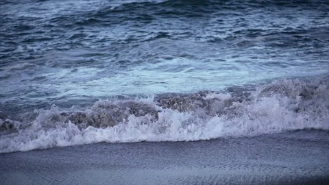 Close up of the waves breaking on the breakwater of mount maunganui beach Stock Footage 214271461