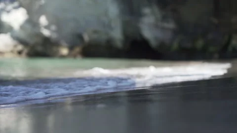 Close up of waves breaking on the breakwater at new chums beach, new zealand Stock Footage 221227806