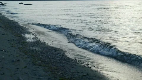 Close up of waves breaking on lake shore Stock Footage 260367509