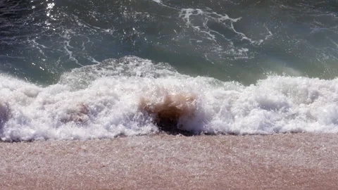 Close up of waves breaking on sandy beach Video stock 131798488