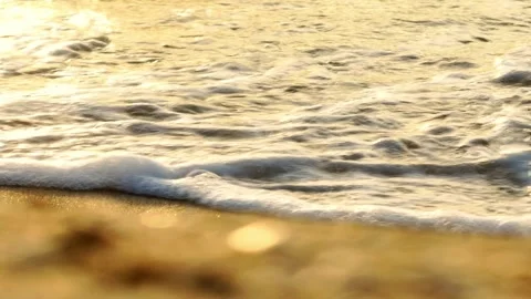 Close-up of waves crashing on the golden beach. Stock Footage 308434530