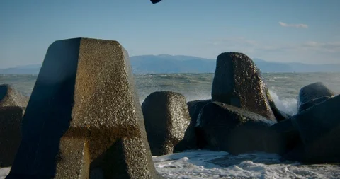 Close Up of Waves Crashing Off Rocks on the Coast of Japan Stock Footage 125716283