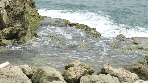 Close up Waves Crashing into Rocks Stock Footage 46627495