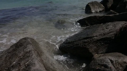 Close Up Waves crashing on Rocks with Rope Fence Video stock 83966168