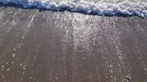 Close-up Waves Crashing on Sandy Beach Stock Footage 307909034