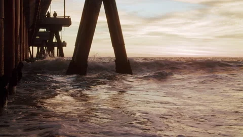 Close-Up On Waves Crashing Under Venice Beach Pier At Sunset 4K 48FPS SLO-MO Stock Footage 223444028