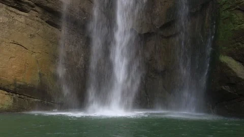 Close-up of the waves in the deep pool at the lower part of the waterfall. Stock Footage 278175034