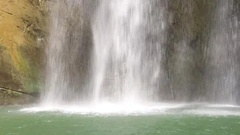 Close-up of the waves in the deep pool at the lower part of the waterfall. Stock Footage 278176485