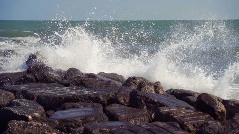 Close up of waves hitting the rock sea, with many waves in the Delta del po. Stock Footage 213661034