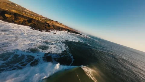 Close-up of waves hitting rocks with spray and motion Stock Footage 339788208