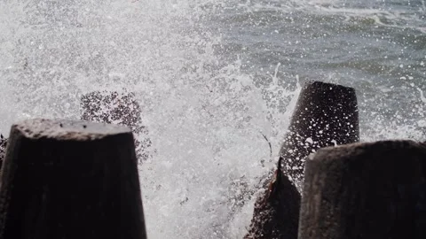 Close-Up of Waves Hitting Tetrapods Stock Footage 321059280