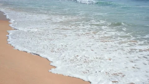 Close Up for waves rolling up to white sandy beach.  Stock Footage 156338283