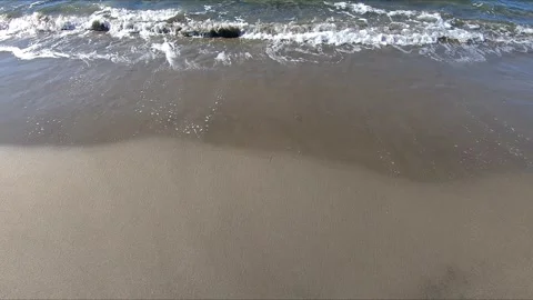 Close up of waves on sandy shore Stock Footage 275250312