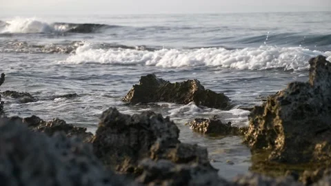 Close up  waves on Seashore in a  beautiful sunset reflected on the sea. Video stock 225237433
