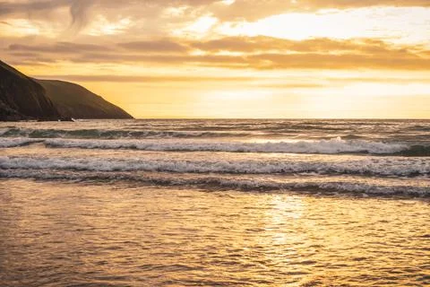 Close up of waves on the shore of a beach Stock Photos