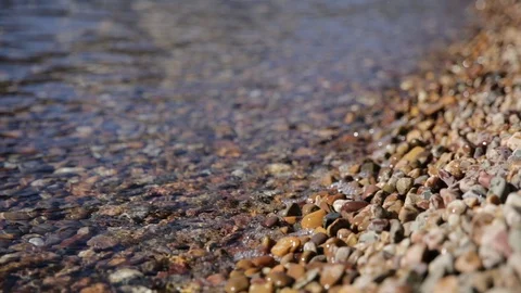 Close Up Waves Splashing on Stones of Mountain Lake Shore Stock Footage 85528189