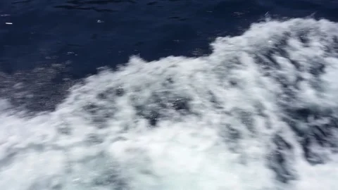 Close up of waves trail behind motor boat at summer day. Blue Mediterranean sea Stock Footage 131979734