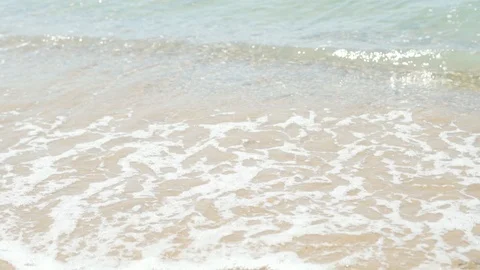 Close-up, waves wash over the sandy beach by the ocean sea, slow motion, relaxat Stock Footage 110297820