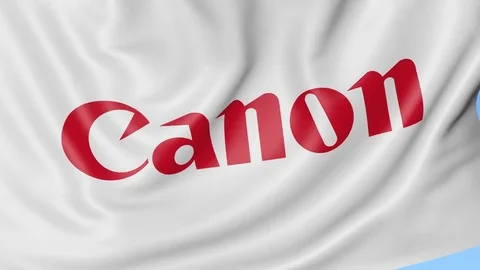 Close-up of waving flag with Canon Inc. logo, seamless loop, blue background Stock Footage 72255283