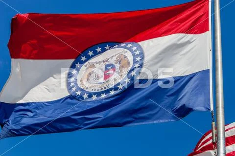 Close up of waving flag of the state of Missouri with blue sky in the backgro Stock Photos