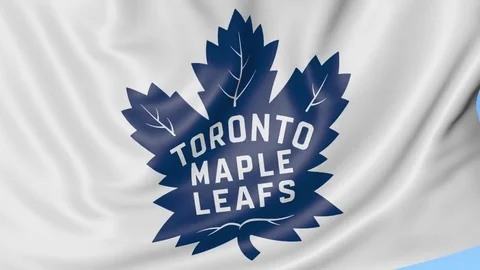 Close-up of waving flag with Toronto Maple Leafs NHL hockey team logo, seamless Stock Footage 72131890