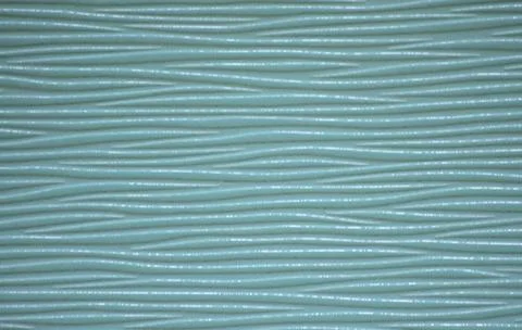 Close-up wavy pattern of natural polished wood painted in aqua color. Stock Photos