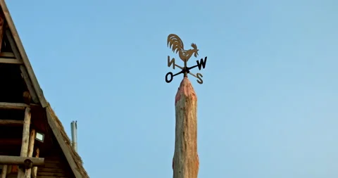 Close-up, weather vane on the pole. Pointer to the parts of the world, weather Stock Footage 144644333