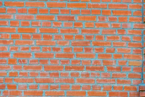 Close-up of a weathered brick wall section in an ancient Central European vil Stock Photos