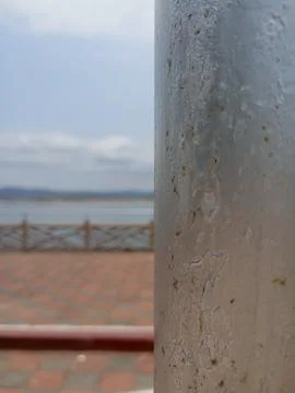 Close-up of weathered concrete pillar with blurred outdoor background Stock Photos