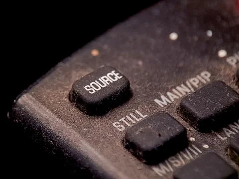 Close-up of a weathered control panel showing buttons for source selection .. Stock Photos