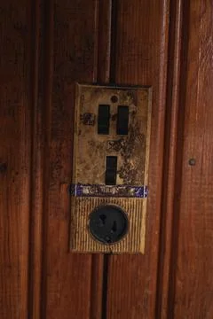 Close Up of Weathered Electrical Switch Panel on Wooden Wall Stock Photos
