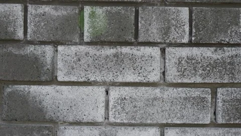Close up of weathered grey rectangular concrete bricks wall texture Video stock 332431473
