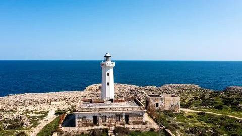 Close-up of weathered lighthouse facing the open sea Stock Photos
