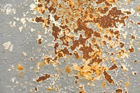 Close up of weathered metal surface with rust and peeling paint texture Stock Photos