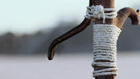 Close up of a Weathered Wooden Post Wrapped in White Rope in an Outdoor Setting Stock Footage 344927615