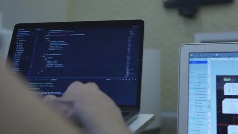 Close-up of web developer's hands programming Javascript, coding HTML on laptop Stock Footage 102783155