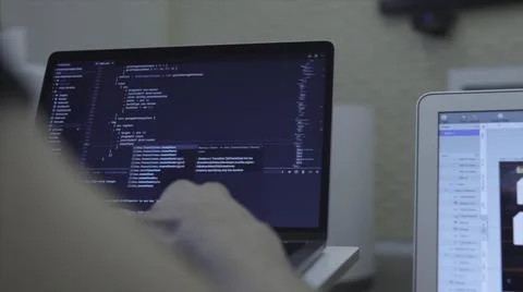 Close-up of web developer's hands programming Javascript, coding HTML on laptop Stock Photos